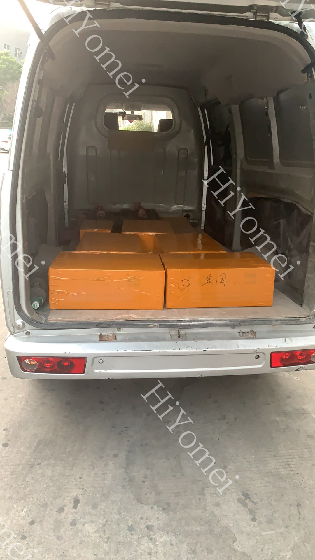 Load the truck and prepare for transport to the port